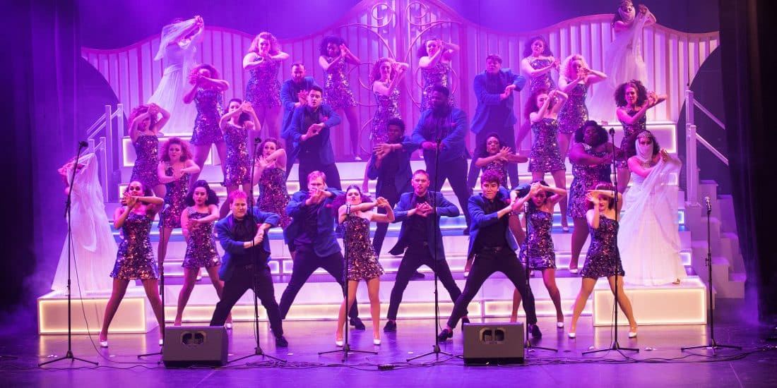 Randolph-Macon Show choir performing on stage during a show.